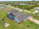 An aerial view of a house with a pool and large backyard at 124 Beau Rivage Dr, Rotonda West, FL 33947