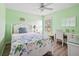 Charming bedroom with white furniture and built-in desk at 124 Beau Rivage Dr, Rotonda West, FL 33947