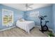 Light and airy bedroom with exercise bike and window seat at 124 Beau Rivage Dr, Rotonda West, FL 33947