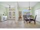 Bright dining room with wood flooring, and view to entryway at 124 Beau Rivage Dr, Rotonda West, FL 33947