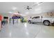 Garage with car lift and ample space for vehicles at 124 Beau Rivage Dr, Rotonda West, FL 33947