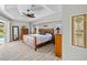 Spacious main bedroom with wood furniture and pool access at 124 Beau Rivage Dr, Rotonda West, FL 33947