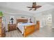 Main bedroom with king-size bed and wood furniture at 124 Beau Rivage Dr, Rotonda West, FL 33947