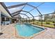 Relaxing screened pool and patio area at 124 Beau Rivage Dr, Rotonda West, FL 33947