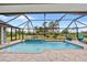 Spacious screened pool area with a large pool at 124 Beau Rivage Dr, Rotonda West, FL 33947