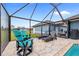 Enjoy this relaxing poolside patio area at 124 Beau Rivage Dr, Rotonda West, FL 33947