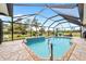 Relaxing screened-in pool and patio area, great for outdoor entertaining at 124 Beau Rivage Dr, Rotonda West, FL 33947