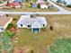 Aerial view of single-story house with surrounding yard at 13284 Buckett Cir, Port Charlotte, FL 33981