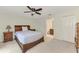 Bedroom with double bed, ceiling fan, and en-suite bathroom access at 13284 Buckett Cir, Port Charlotte, FL 33981