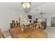 Formal dining room with wood table and chairs, adjacent to the living room at 13284 Buckett Cir, Port Charlotte, FL 33981