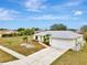 House exterior with landscaping and driveway at 13284 Buckett Cir, Port Charlotte, FL 33981