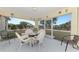 Enjoyable screened porch with patio furniture and a view of the backyard at 13284 Buckett Cir, Port Charlotte, FL 33981