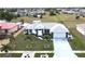 Aerial view of a single-story home with a gray roof and landscaping at 13323 Copper Ave, Port Charlotte, FL 33981