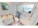 Clean bathroom with shower/tub combo and updated vanity at 13323 Copper Ave, Port Charlotte, FL 33981