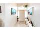 Bright entryway with tiled floors, a console table, and artwork at 13323 Copper Ave, Port Charlotte, FL 33981