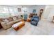 Living room with neutral-toned furniture and a view into the kitchen at 13323 Copper Ave, Port Charlotte, FL 33981