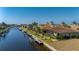 Aerial view showcasing canal-front property and dock at 1406 Mediterranean Dr, Punta Gorda, FL 33950