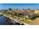 Aerial view of canal-front home with private dock at 1406 Mediterranean Dr, Punta Gorda, FL 33950