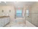 Spa-like bathroom with soaking tub and walk-in shower at 1406 Mediterranean Dr, Punta Gorda, FL 33950