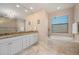 Double vanity bathroom with soaking tub and shower at 1406 Mediterranean Dr, Punta Gorda, FL 33950