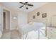 Spacious bedroom with king-size bed and ceiling fan at 1406 Mediterranean Dr, Punta Gorda, FL 33950