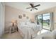 Bright bedroom with king-size bed and water view at 1406 Mediterranean Dr, Punta Gorda, FL 33950