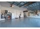 Spacious garage with epoxy flooring and overhead storage at 1406 Mediterranean Dr, Punta Gorda, FL 33950