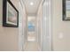 Light and airy hallway with access to multiple rooms at 1406 Mediterranean Dr, Punta Gorda, FL 33950