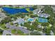 Community pool, tennis courts, and lakefront views at 1433 Red Oak Ln, Port Charlotte, FL 33948