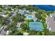 Community aerial view showing pool, tennis courts, and clubhouse at 1433 Red Oak Ln, Port Charlotte, FL 33948