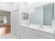 Bathroom with double vanity and access to bedroom at 1433 Red Oak Ln, Port Charlotte, FL 33948