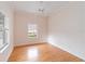 Well-lit bedroom with wood flooring and window at 1433 Red Oak Ln, Port Charlotte, FL 33948