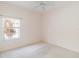 Bedroom with carpeted floor, ceiling fan and window at 1433 Red Oak Ln, Port Charlotte, FL 33948