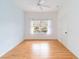 Bedroom featuring light walls, wood flooring, and a window at 1433 Red Oak Ln, Port Charlotte, FL 33948