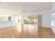 Bright living room with hardwood floors and sliding glass doors at 1433 Red Oak Ln, Port Charlotte, FL 33948