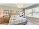 Bright bedroom featuring a king-size bed and neutral decor at 14386 San Domingo Blvd, Port Charlotte, FL 33981