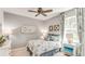 Bedroom with a bed, nightstands, and coastal-themed decor at 14386 San Domingo Blvd, Port Charlotte, FL 33981