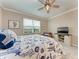 Comfortable bedroom with a king-size bed and TV at 15169 Spanish Point Dr, Port Charlotte, FL 33981