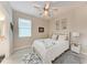 Bedroom with ceiling fan and ensuite bathroom at 15169 Spanish Point Dr, Port Charlotte, FL 33981