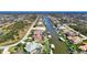 Aerial view of waterfront homes with private docks and lush landscaping at 15706 Viscount Cir, Port Charlotte, FL 33981