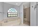 Bathroom with soaking tub and walk-in shower at 15706 Viscount Cir, Port Charlotte, FL 33981