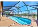 Enclosed heated pool with canal views at 15706 Viscount Cir, Port Charlotte, FL 33981