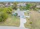 Aerial view of a single-story home with a pool and canal view at 1638 Viscaya Dr, Port Charlotte, FL 33952