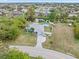 Aerial view of a charming light-blue home with a pool at 1638 Viscaya Dr, Port Charlotte, FL 33952