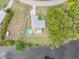 Aerial view of home near canal, showcasing backyard and pool at 1638 Viscaya Dr, Port Charlotte, FL 33952