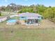 Aerial view of the house, highlighting the backyard pool and patio at 1638 Viscaya Dr, Port Charlotte, FL 33952