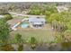 Aerial view of a single-story home with a pool and canal access at 1638 Viscaya Dr, Port Charlotte, FL 33952