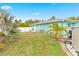 Large backyard with grassy area and a partially visible pool at 1638 Viscaya Dr, Port Charlotte, FL 33952