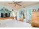 Spacious bedroom with king bed, coastal decor and built-in shelving at 1638 Viscaya Dr, Port Charlotte, FL 33952