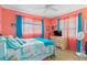 Relaxing bedroom with light coral walls and flamingo bedding at 1638 Viscaya Dr, Port Charlotte, FL 33952